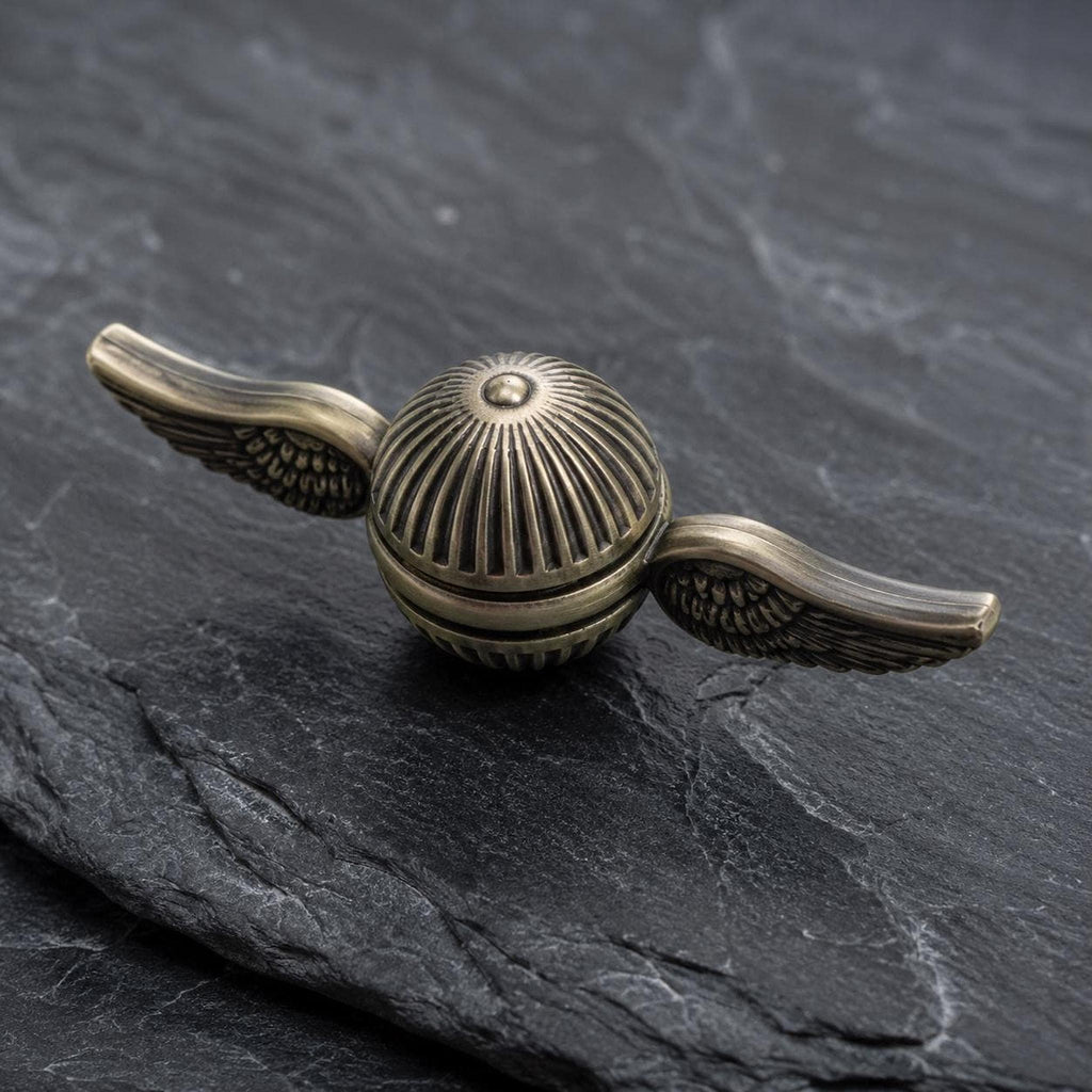 Spinner ailé en métal : finition bronze ancien